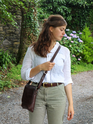Small crossbody bag for women in dark brown leather, made in Ireland.