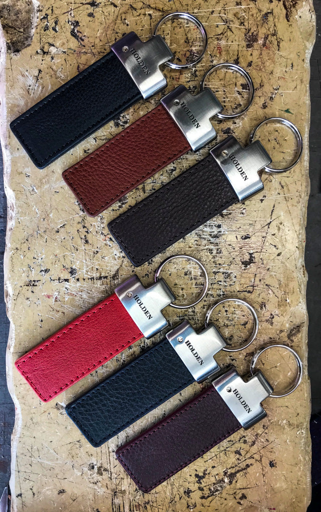 Leather key fobs in black, chestnut, dark brown, red, dark navy and burgundy