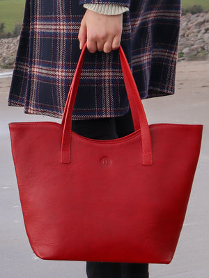 Shot in context photo of our Caitlin classic large tote bag in red leather, made in Ireland