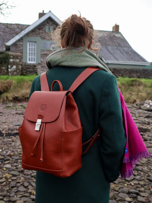 Leather drawstring duffle backpack, handmade in Ireland. Available in Chestnut, Black, Dark brown, Burgundy, Navy and Red. Side View