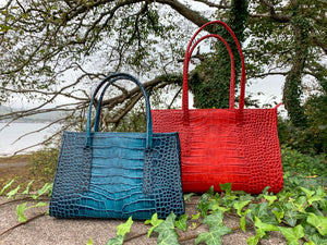Limited edition leather handbags in blue and red, made in Ireland