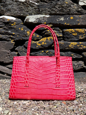 Limited edition raspberry pink leather handbag, made in Dingle, Ireland on the Slea Head Drive
